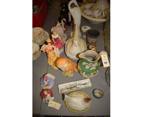 A Beswick ware ornament modelled as an owl, model no. 1046; two Royal Doulton figurines, HN1467 'Monica' and HN2167 'Home Aga
