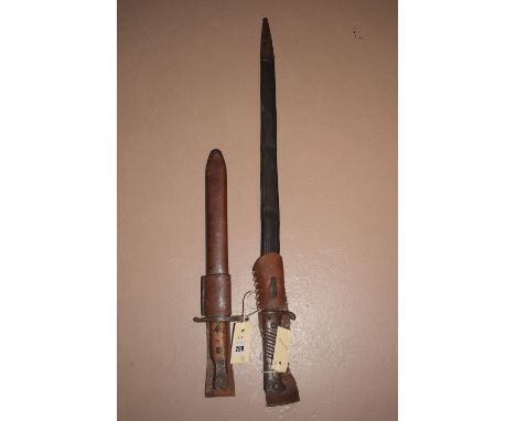 WWII bayonet with wooden guard and leather sheath; WWI German Mauser bayonet model 98/05, with saw-tooth edge, wooden grips h