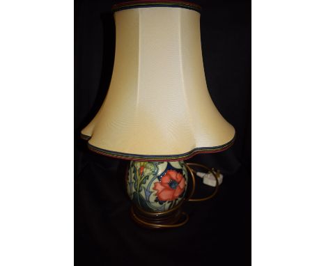 A Moorcroft Poppy pattern table lamp.  (15)