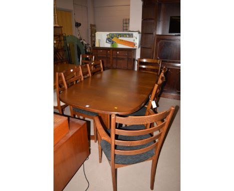 A G Plan eight-piece modern oak dining suite, comprising: six plus two ladder back dining chairs; an extending dining table w