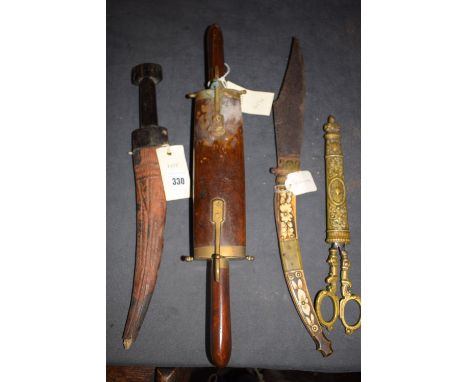 A 19th Century Middle Eastern  dagger, with ebony handle and leather scabbard with embossed decoration; a Spanish dagger with