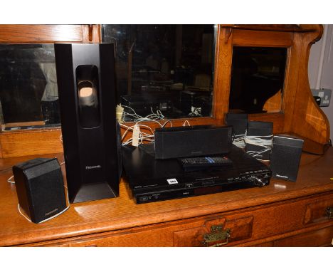 A Panasonic surround sound system 5.1 model no. SA-PT450, with remote control.
