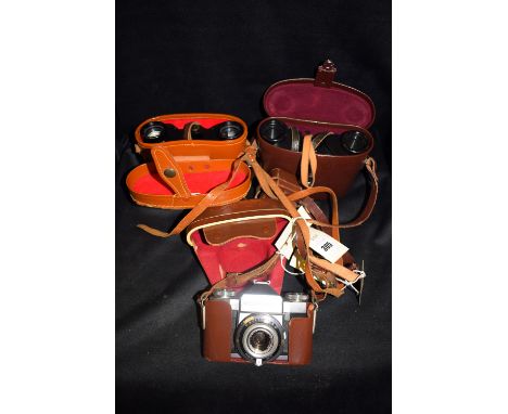 A pair of Karl Zeiss Jena Delirintem 8 x 30 binoculars, with leather carrying case; a pair of Boots 8 x 30 in leather carryin