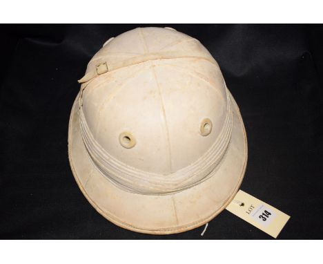 A pith helmet, by Locke & Co. Hatters, London.