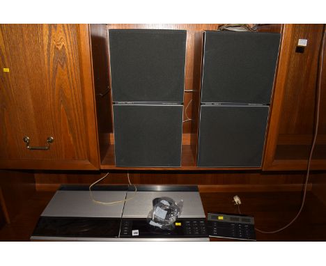 A Bang & Olufsen Beocenter 7700; together with Master control panel 7700; and a pair of Bang & Olufsen speakers Beovox Perspe