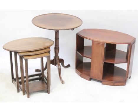 A nest of three oval side tables, an Edwardian mahogany circular to turned supports and tripartite support, diameter 57cm, an