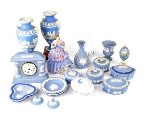 A group of Wedgwood blue jasperware include a pair of baluster vases with covers in the Classical style with raised Greek fig