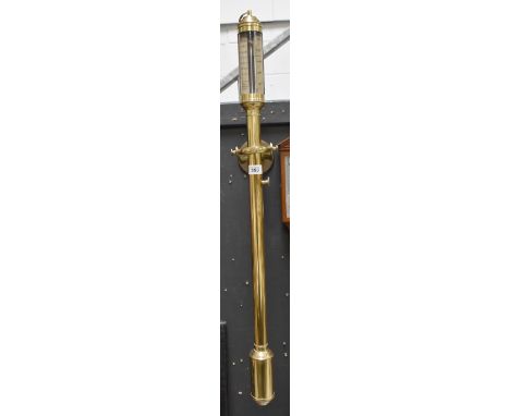 A reproduction brass ship's stick barometer on a gimbal mount wall bracket, signed to face J.J.B.L.M. 16a 22, R.N.Desterro Li