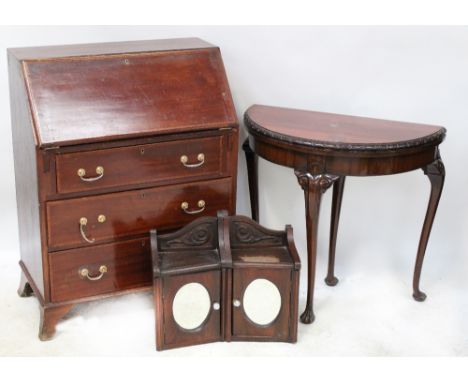 An Edwardian mahogany inlaid bureau, drop-down desk top with interior pigeon holes over three drawers to bracket supports, 10