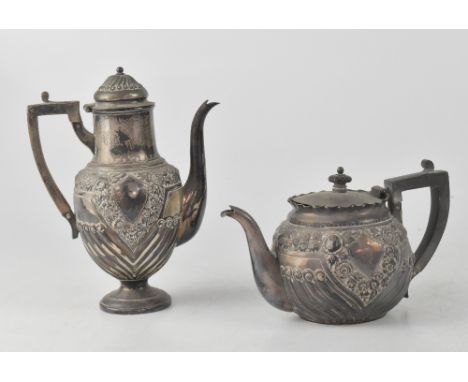 A Victorian matching pair of hallmarked silver bachelor teapot, height 12.5cm, and coffee pot, height 21cm, decorated in the 