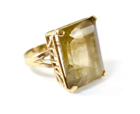 A 9ct gold fashion ring with large cut smoky quartz stone, size K, approx 8.4g. CONDITION REPORT Clear hallmarks, some small 