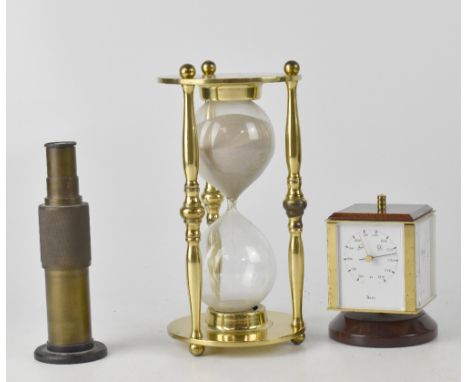 A large modern brass egg timer in the antique style, height 24cm, a Sewills of Liverpool revolving square faux glass clock, w