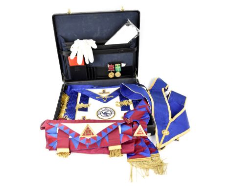 A black attaché case containing a quantity of Masonic memorabilia relating to the West Lancashire Lodge to include aprons, sa