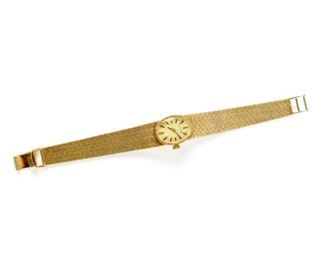 Longines; a 1970s ladies' manual wind bracelet wristwatch, the gold oval dial set with bar increments, with original box and 