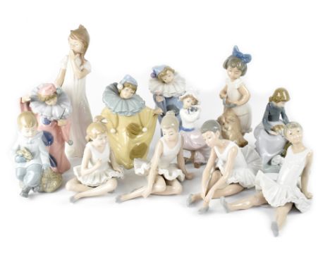 Twelve Nao figures to include clowns in various coloured costumes, various ballerinas, young girl in nightdress, young yawnin