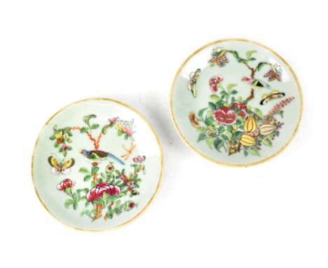 A pair of 19th century celadon Famille Rose plates with enamel decoration of peonies, birds and butterflies, diameter 14.5cm 