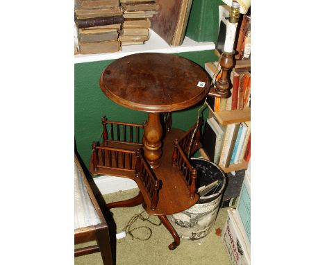 A Victorian burr walnut revolving bookcase, the circular top with an adjustable light fitting, on a turned column with shaped