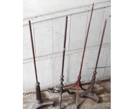 Four various 19thC fire screen pole stands.