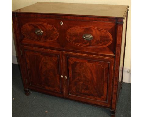 An early 19thC mahogany secretaire chest, the crossbanded top above a fitted fall front drawer,with leather insert with figur