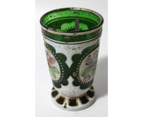 A 19thC Bohemian green glass gilt highlighted and enamel beaker, the bell shaped body decorated with panels of flowers predom