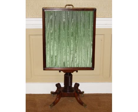 A Regency mahogany adjustable fire screen, with green watered silk pleated top and sliding banner, reeded frame and on a turn