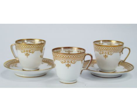 Three Russian porcelain tea cups and two saucers, Period of Alexander III (1884-1894), the gilt decoration and with green imp