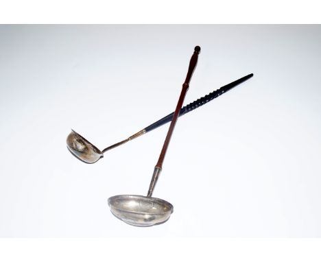 A George III silver toddy ladle, with a turned wooden handle, Alexander Gardner, Edinburgh. 50.5cm long, and a further ladle 