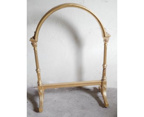 A Victorian giltwood fire screen or gong stand, 119cm high.