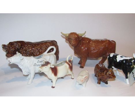 Various 20thC pottery figures of cattle, to include a Highland bull, possibly Melba, another in treacle glaze, horned calf, h