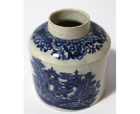 An early 19thC Staffordshire pearlware blue and white inkwell, the cylindrical body with an upper floral banding, decorated w