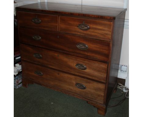 An early 19thC mahogany chest of drawers, the hinged caddy top with a crossbanded border over an arrangement of two short dra