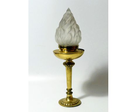 A brass torch form table lamp, 46cm high.