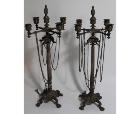 A pair of 19thC silver plated candelabra, with four branch/five light top, with chains around a taper column with elephant ma