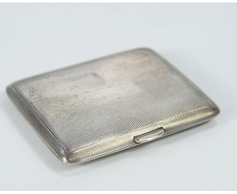 A George V engine turned silver cigarette case, Chester 1938, 4oz.