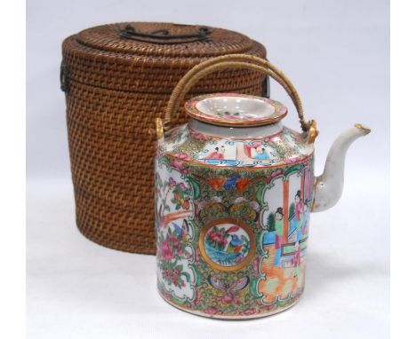 Early 20th century Chinese Canton famille rose teapot decorated with panels of figures in foliage, 18cm high, in original wov