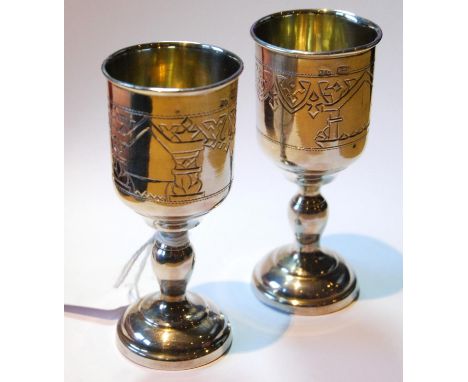 Near pair of Russian silver kiddush cups with engraved bands on moulded feet, Moscow c. 1910, 85g or 3oz. 