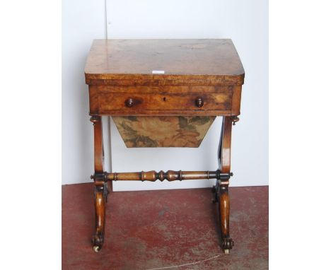 19th century walnut games table, the swivel fold-over top enclosing a satinwood and ebony chess board, with a short drawer ab