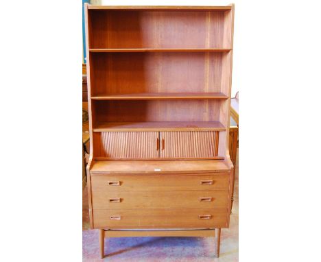 Danish retro teak secretaire bookcase designed by Børge Mogensen, c. 1960s, with open shelving above a tambour roller shutter