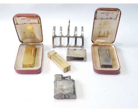 Dunhill EP storm lighter, 1940s, and another, engine turned, with case, two rolled gold lighters, one 1966, a small silver to