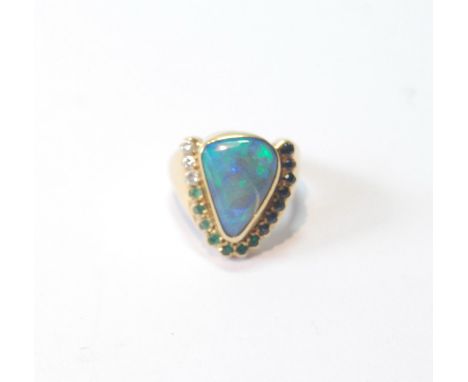 Gold dress ring of triangular form with doublet black opal and other gems, in 18ct gold, size R. 