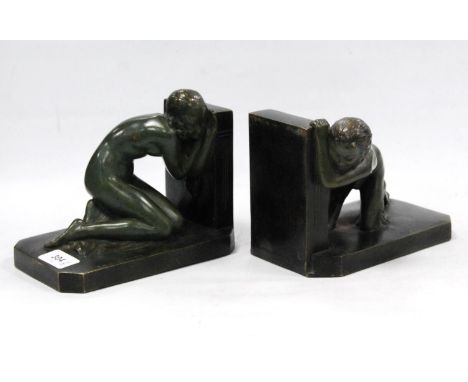 After Raoul Bénard (French 1881 - 1961) Pair of Art Deco style verdigris bronze figural bookends modelled as a kneeling nude 