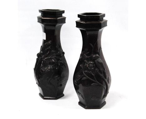 Pair of Japanese bronze vases of octagonal form, cast with birds in foliage, 28cm high. 