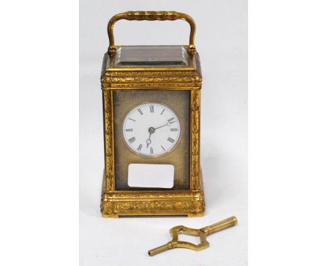 French gilt metal carriage clock, with silvered lever platform with compensated balance in a gorge case, 13cm high, with key.