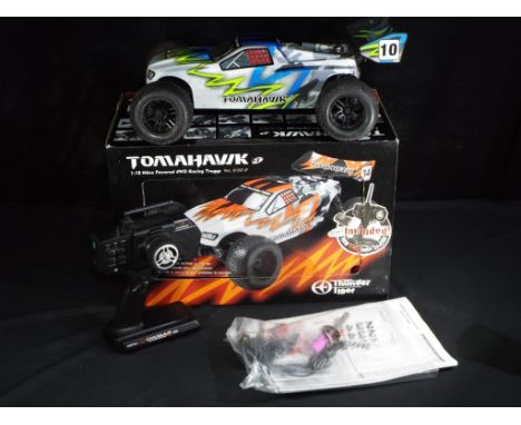 Thunder Tiger  - A boxed Thunder Tiger Tomahawk 1:10th scale RC Nitro Car. Item comes complete with instructions, transmitter