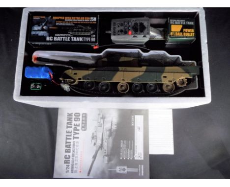 RC Tank - 1/24 scale remote controlled tank with a firing range of about 25 metres, equipped with motor air gun. Appears to b