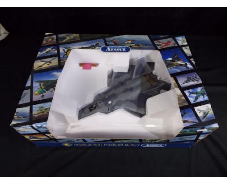 Franklin Mint Armour Collection - No.B11F020 A boxed diecast 1:48 scale F22 RAPTOR . The model appears to be in Mint conditio