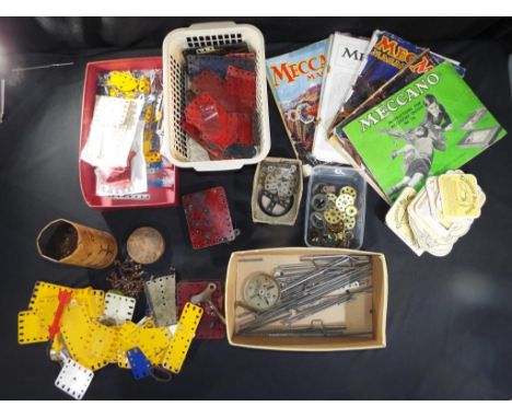 Meccano - A large quantity of vintage Meccano, parts, accessories and ephemera.  Lot includes, magazines, plates, brackets, a