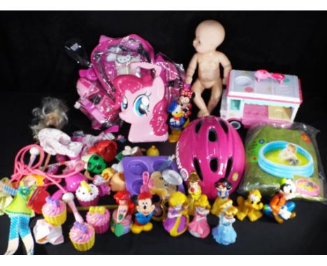 A good mixed lot of children's toys, games, including roller skates, paddling pool, doll and Disney characters.