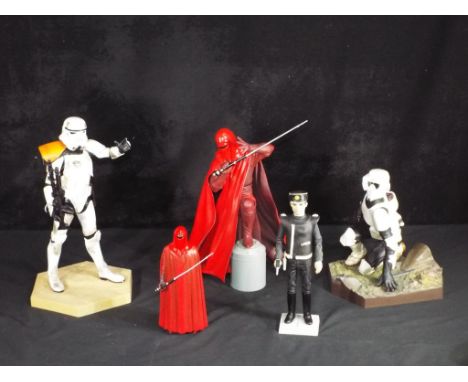 Star Wars - Three 12 inch Star Wars figures and one 7 inch figure. Figures are unbranded and appear to be made from resin and