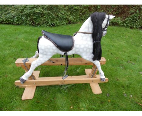 Rocking Horse - a vintage dappled grey rocking horse with black leather studded saddle, leather harness and reins, metal stir